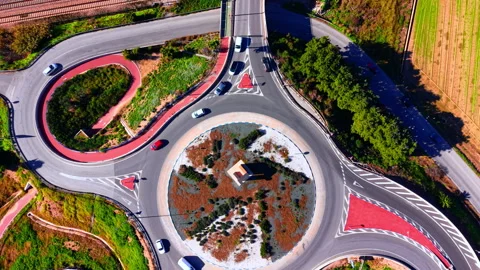 Top view of a circular traffic roundabout with cars Stock Footage 330491374