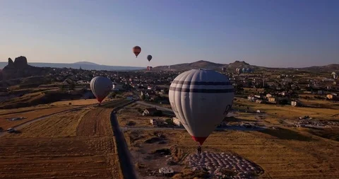 Top view of city and floating balloons. Before sunset. Close-up of gray balloon Stock Footage 104861099