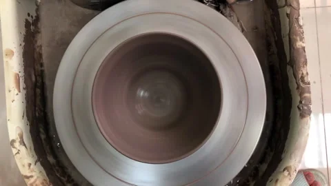 Top view of clay bowl spin on pottery wheel. Stock Footage 337211251