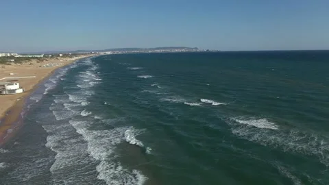 Top view of clear blue water with waves on a sandy beach. Stock Footage 221183228