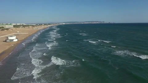 Top view of clear blue water with waves on a sandy beach. Stock Footage 221183243