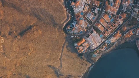 Top view of the cliffs, the beach and the city of Los Gigantes Tenerife Shooting Video stock 74544742