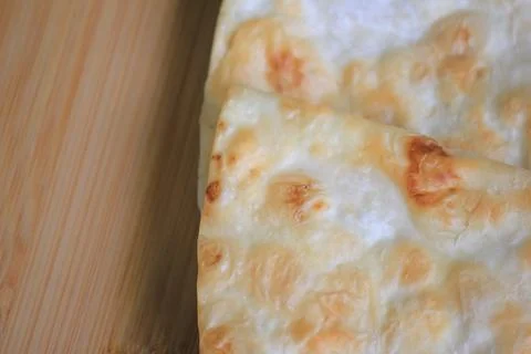 Top view close up of crispy layered flatbread on a wooden board with copy s.. Stock Photos