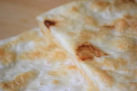 Top view close up of crispy layered flatbread on a wooden board with copy s.. Foto stock