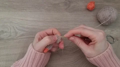 Top view close-up of female hands crocheting. Handmade knitted toys. Stock Footage 309303377