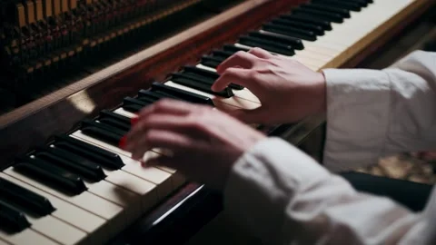 Top-view close-up of female hands playing piano keys Stock Footage 325729211