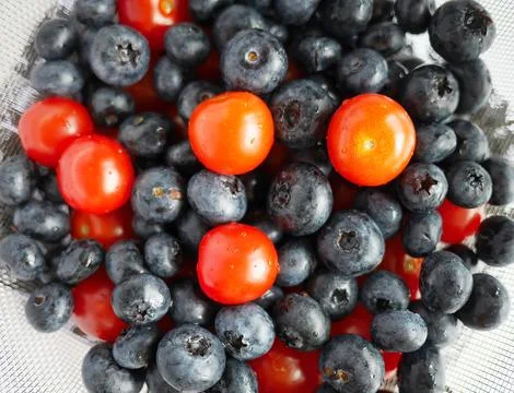 Top view close-up full frame freshness of blueberries and cherry tomatoes 写真素材