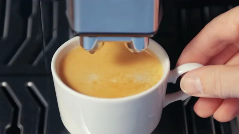 Top view. Close up of hand taking coffee of cup from automatic coffee machine. Stock Footage