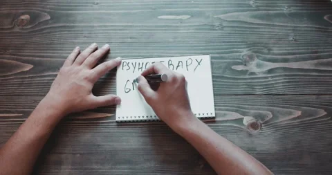 Top view, close-up hands of a man writing psychotherapy group work Stock Footage 260938193