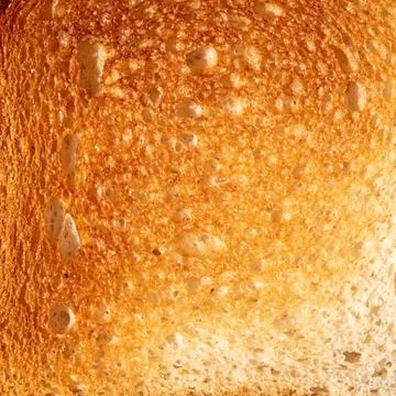 Top view close-up image displaying textured surface of sliced bread Stock Photos
