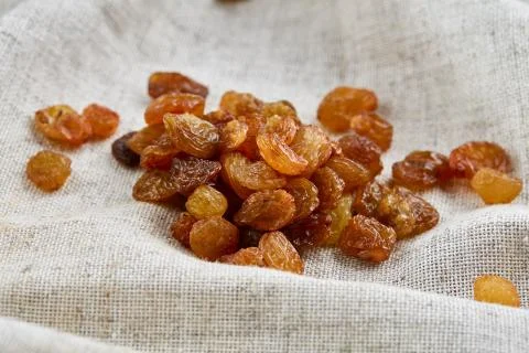 Top view close-up picture of dried apples on light cotton tablecloth, selective Stock Photos