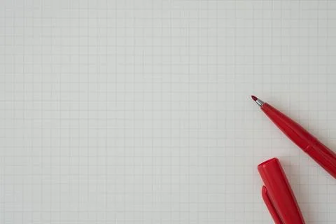 Top view, Close-up of Red Felt-tip Pen on Graph Paper, Copy Space for Text Foto stock