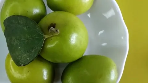 Top view close up of ripe green jujube fruit on a white plate. Stock Footage 280354530