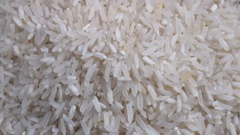 Top view close up shot of pile of spinning white rice Stock Footage 280154451