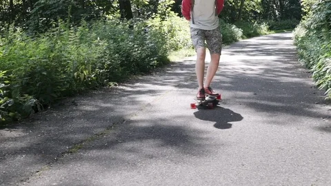 Top view of a close-up of a skateboarder on a long board Super slow shooting Video stock 80437019