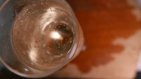 Top view (close-up): sparkling wine bubbles rising in a glass. Champagne glass 스톡 동영상 341453086