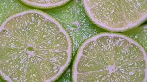 Top view close-up stack of natural juicy lime slices Stock Photos