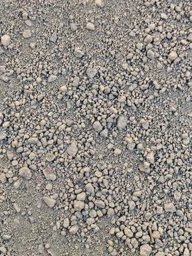 Top View Close-Up Texture of Dry Granular Soil and Small Pebbles Stock Photos