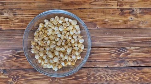 Top view of close up video of hands take popcorn, time lapse Stock Footage 88491753