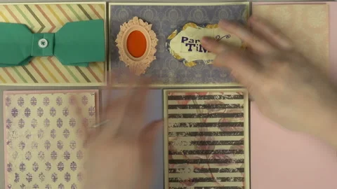Top view, close up of working process of craftswoman. Time lapse of scrapbooking Stock Footage 106689223