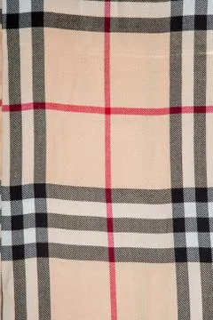 Top view closeup on flat lay elegant beige checked scarf different strips Fotos de archivo