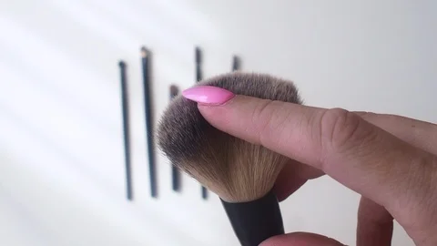 Top view closeup of various professional female cosmetics brushes for makeup . Stock Footage 111396853