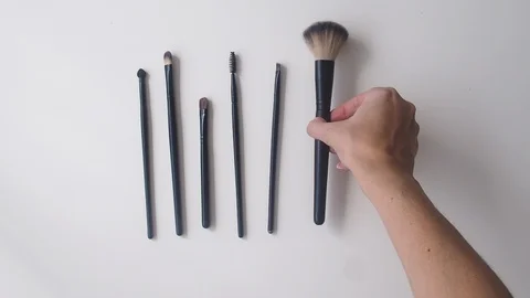 Top view closeup of various professional female cosmetics brushes for makeup . Stock Footage 111397205