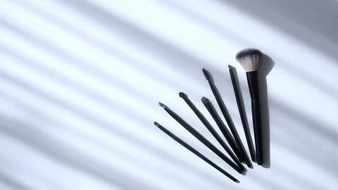 Top view closeup of various professional female cosmetics brushes for makeup . Stock Footage 111588061