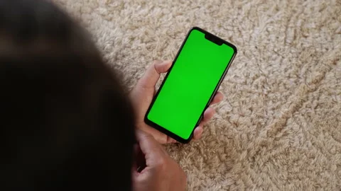 Top View, Closeup View of Phone in Female Hands with Green Mock-up Screen Stock Footage 195093675