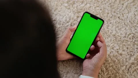 Top View, Closeup View of Smartphone in Female Hands with Green Mock-up Screen Stock Footage 195332112