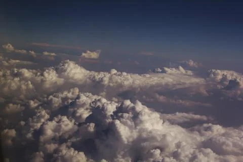 Top view of clouds from an airplane window on a sunny day 스톡 사진