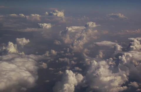 Top view of clouds from an airplane window on a sunny day Stock Photos