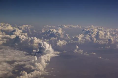 Top view of clouds from an airplane window on a sunny day Stock Photos