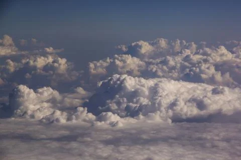 Top view of clouds from an airplane window on a sunny day Stock Photos