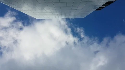 Top up view of clouds moving in the sky near glass building in Oslo, Norway Stock Footage 111324448