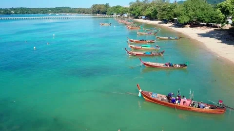 Top view of coast with sea pier and bright fishing boats Stock Footage 161563272
