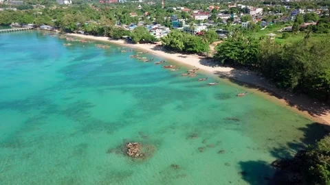 Top view of coast with sea pier and bright fishing boats Stock Footage 161563280
