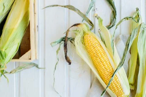Top view of cob corn on the wooden background Stock Photos