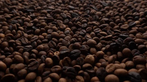 Top View Of Coffe Beans Falling From Camera Down To Coffe Beans Background Video stock 116291334