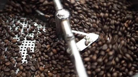 Top View Of Coffee Beans Being Rotated In A Coffee Machine, UK Stock Footage 133184435