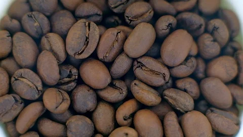 Top view - Coffee beans roasted rotating. Video stock 99836065