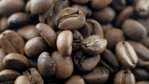 Top view - Coffee beans roasted rotating. Stock Footage 100080978