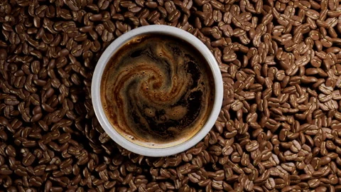 Top view of coffee cup and roasted beans. Stock Footage 328628364
