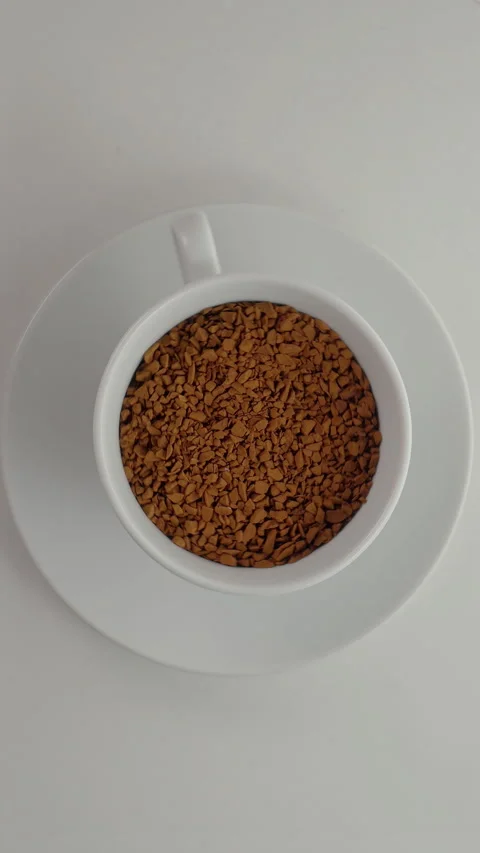 Top view of coffee cup changing from beans to grounds to black brew Stock Footage 344995154