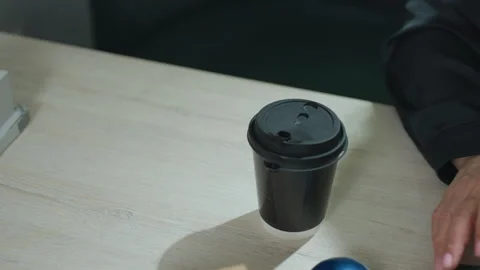 Top View of Coffee Cup on Desk with Real Estate Model and Mouse Nearby Stock Footage 310801485