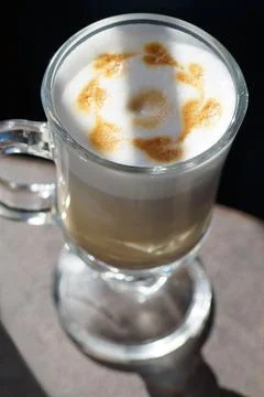 Top view of a coffee latte in the shape of small hearts on a sunny day Stock Photos