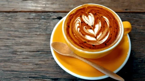 Top view of Coffee mug with heart Latte art. 動画素材 334648799
