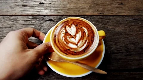 Top view of Coffee mug with heart Latte art. 動画素材 334650851