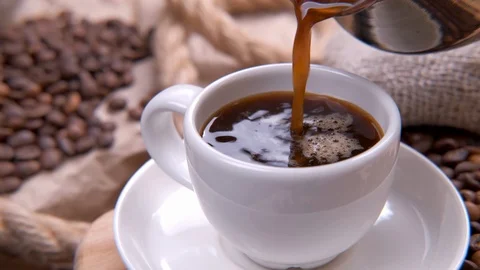 Top view of coffee pour into cup from cezve Stock Footage 115092110