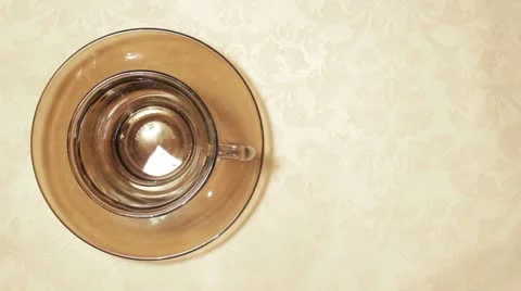 Top View of Coffee Poured in to Cup full of Creamer Stock Footage 10868939